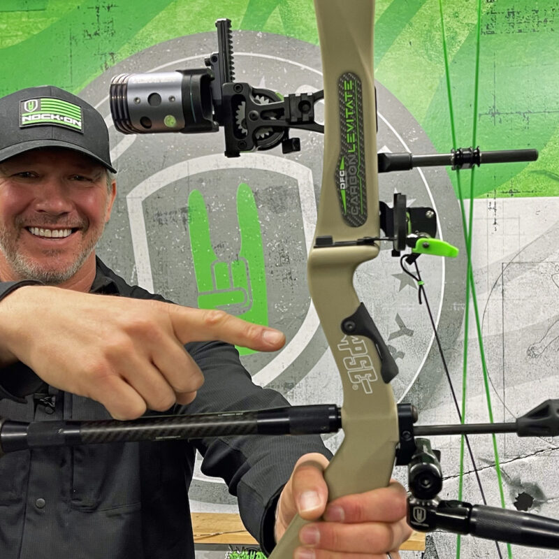 John Dudley holding a PSE Carbon Levitate with the Nock On Ultraview Custom Grip.
