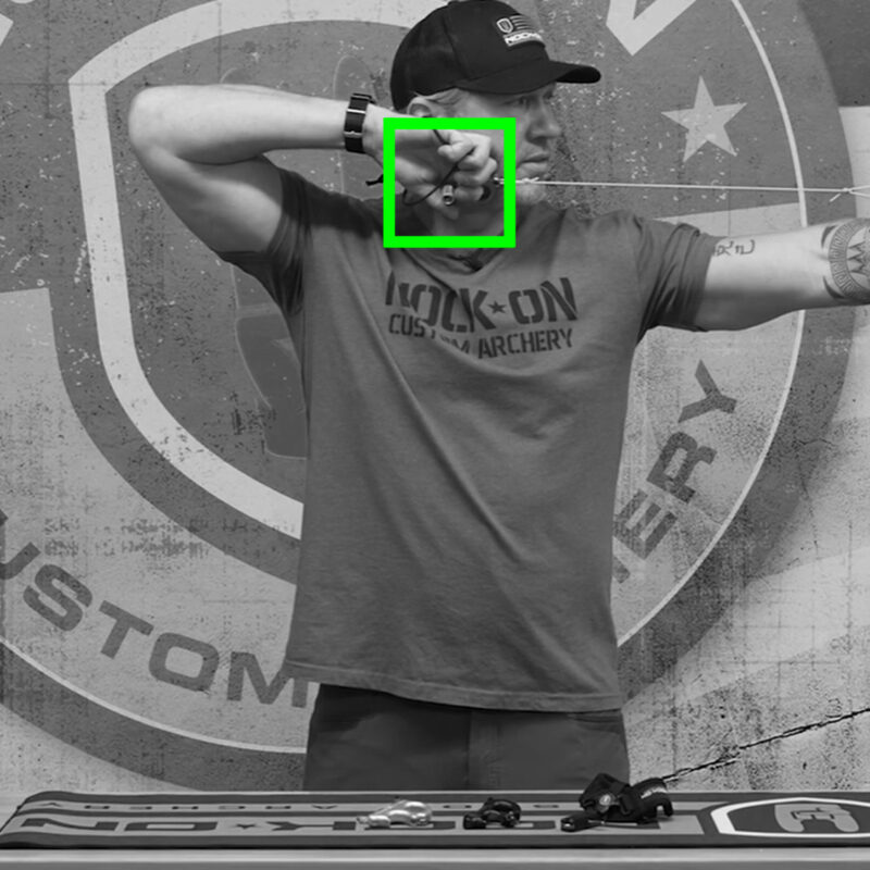 John Dudley showing the proper way to anchor when drawing a compound bow.
