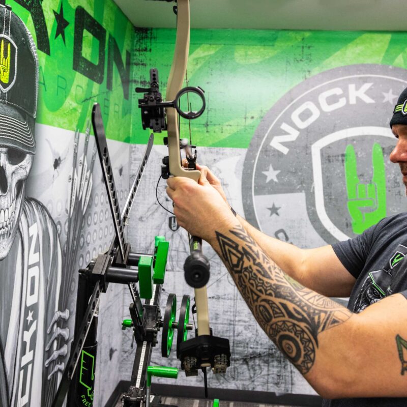 John Dudley showing his different compound target bows.