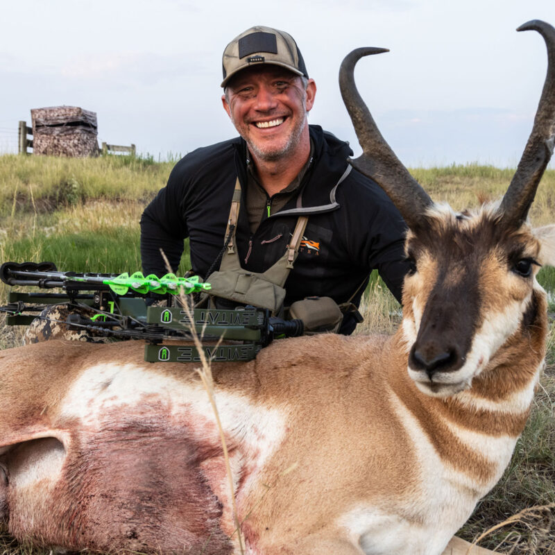 John Dudley with an antelope he shot bowhunting over a waterhole.