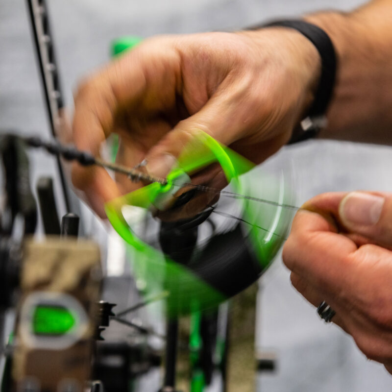 John Dudley showing how to fix a slipped center serving on a compound bow.