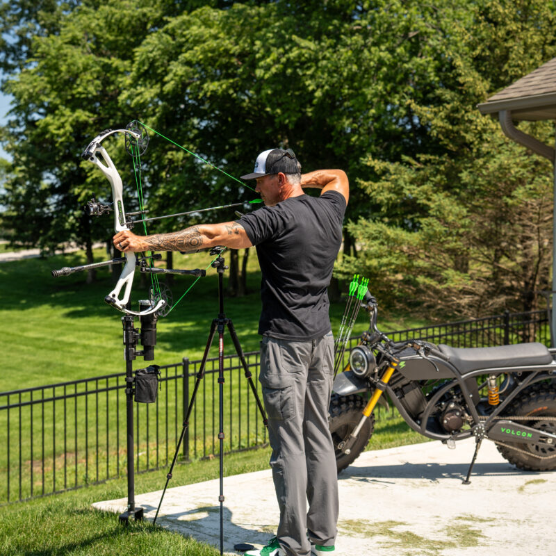 John Dudley at full draw with a volcon bike.