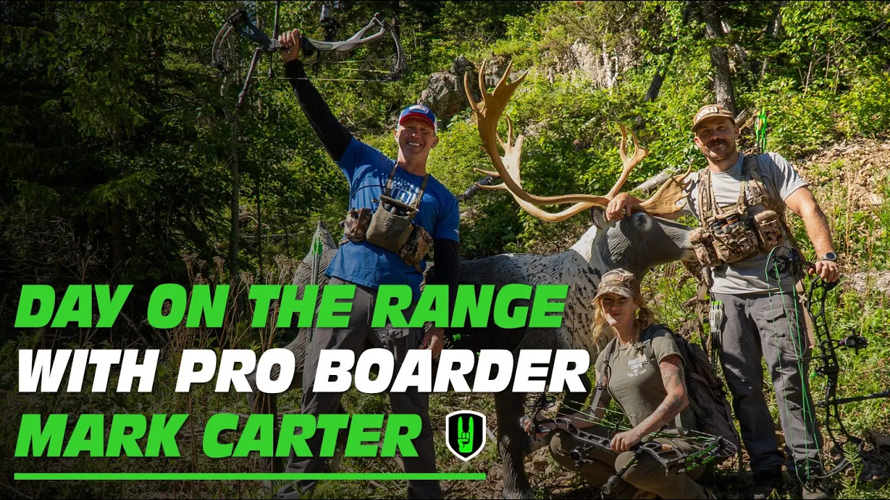 Day On the Range With Pro Boarder Mark Carter 1 John Dudley and Mark Carter celebrating on a mountain side with a 3d target.