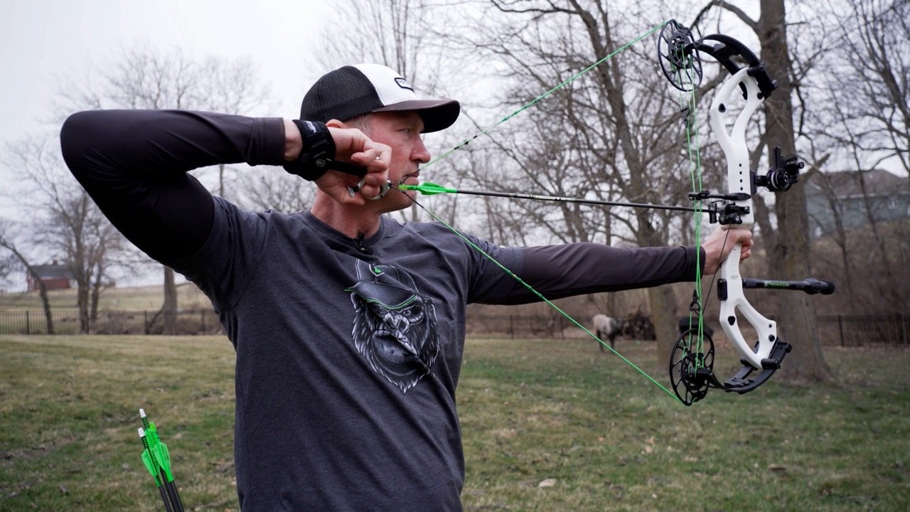 John Dudley demonstrating proper use of a silverback tension-activated release in archery.