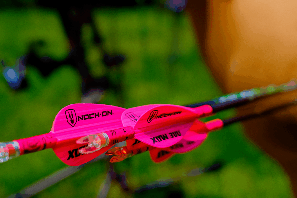 School Of Nock 7 Close-up of three arrows grouped tightly, inspired by John Dudley’s secret method for tighter shooting groups.
