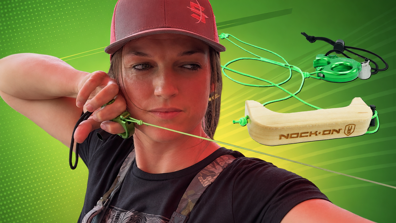 archer at full draw with green Silverback release aid and wooden training tool on green background